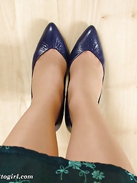Naughty looking blonde wearing blue high heels